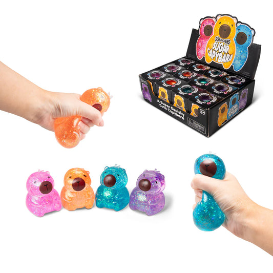 Colourful capybara-shaped squishies with a hand reaching for one, displayed against a white background.