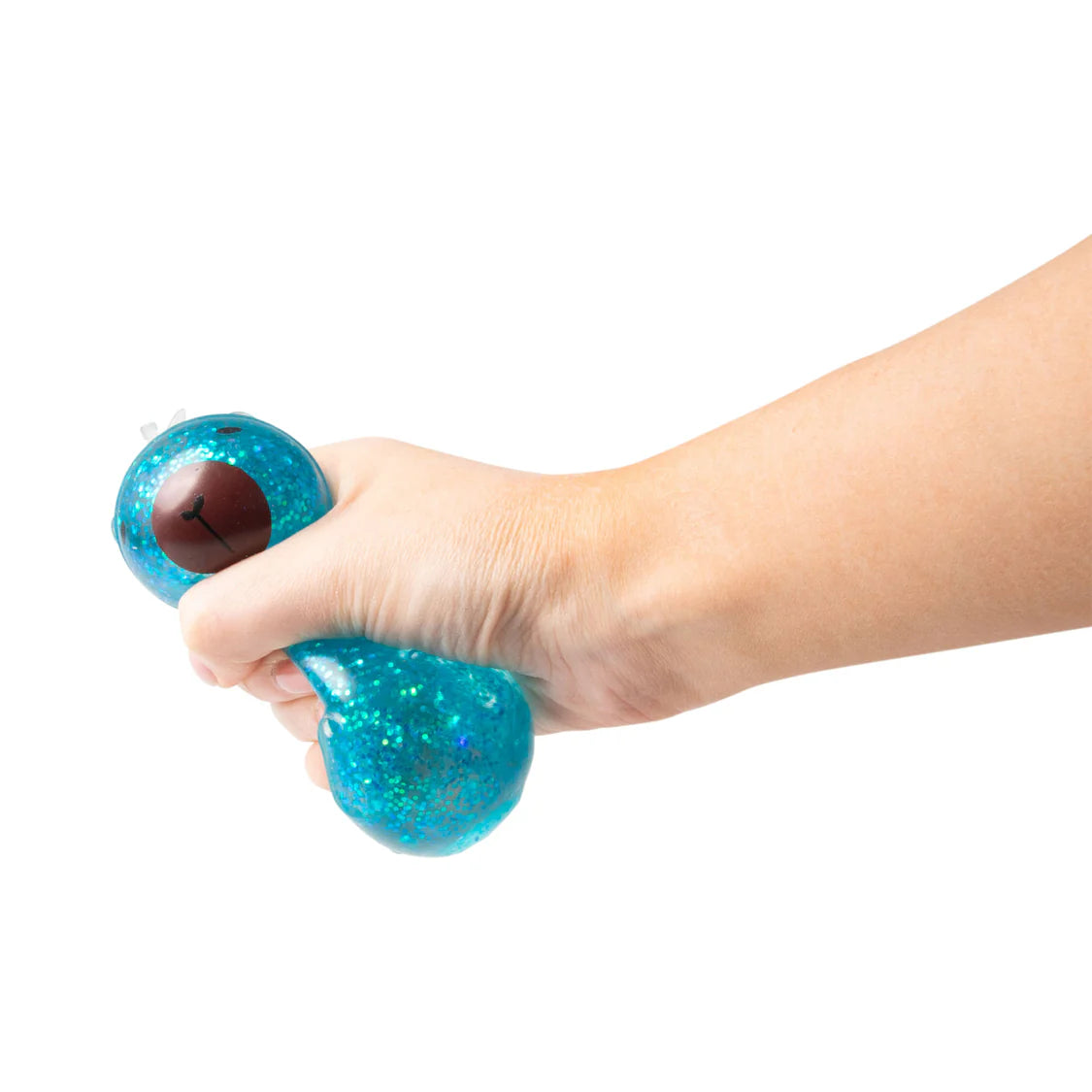 Hand holding a blue glittery stress ball against a white background
