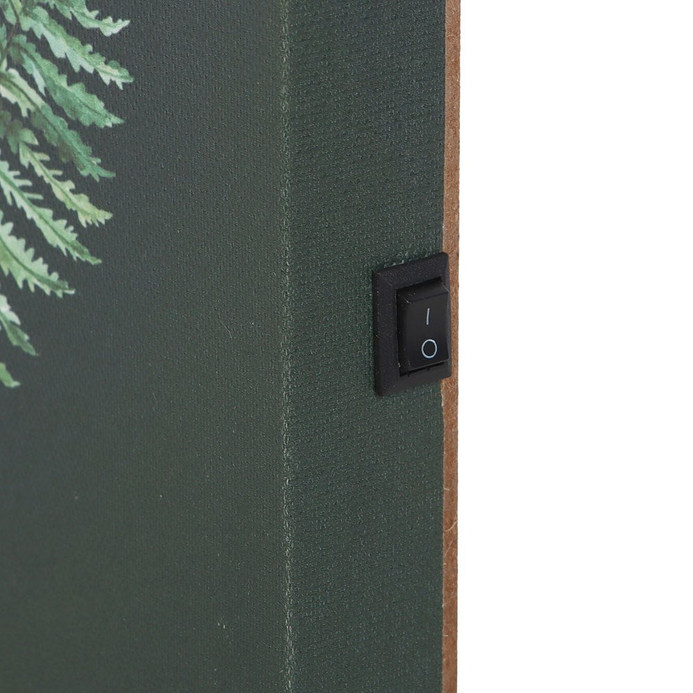Close-up of a dark green textured panel with a black rocker switch and a brown side edge, against a white background.