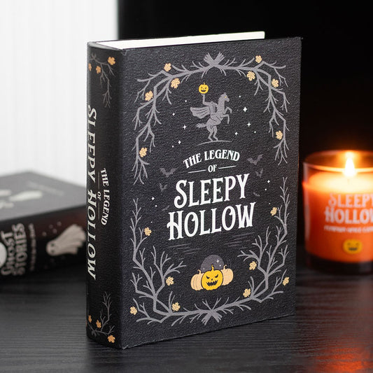 Book Box titled 'The Legend of Sleepy Hollow' with decorative cover featuring pumpkins and a horse, candle in the background.