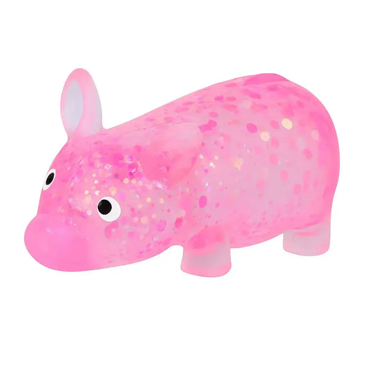 Pink glittery pig squish toy on a white background