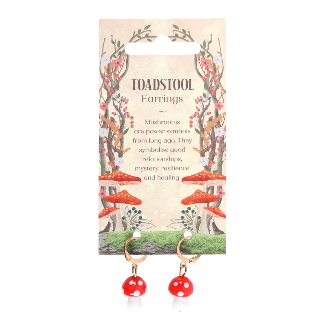 Red and white polka dot mushroom dangle earrings on a decorative cardboard backing card labeled 'TOADSTOOL EARRINGS'.