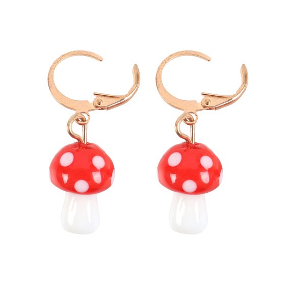 Mushroom-shaped earrings with red caps and white stems on a white background