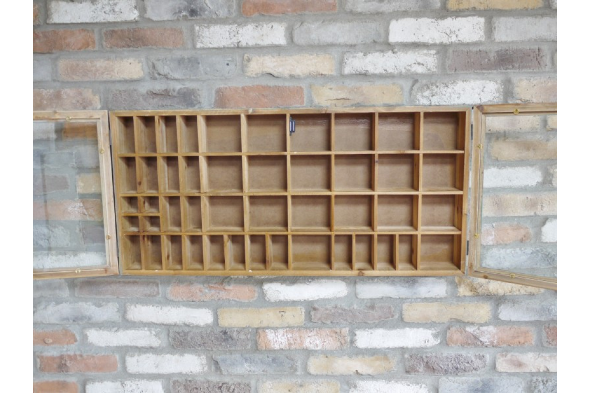 Wooden shelf mounted on a brick wall