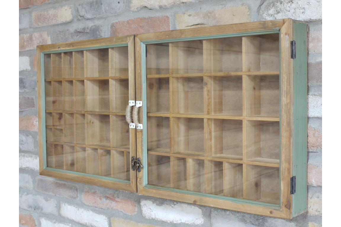 Wooden wall-mounted cabinet with glass doors against a stone wall background