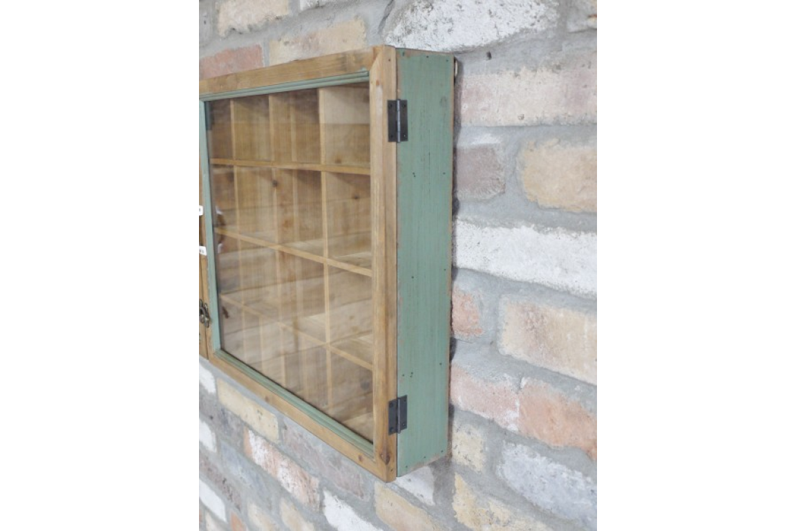 Wooden cabinet mounted on a stone wall