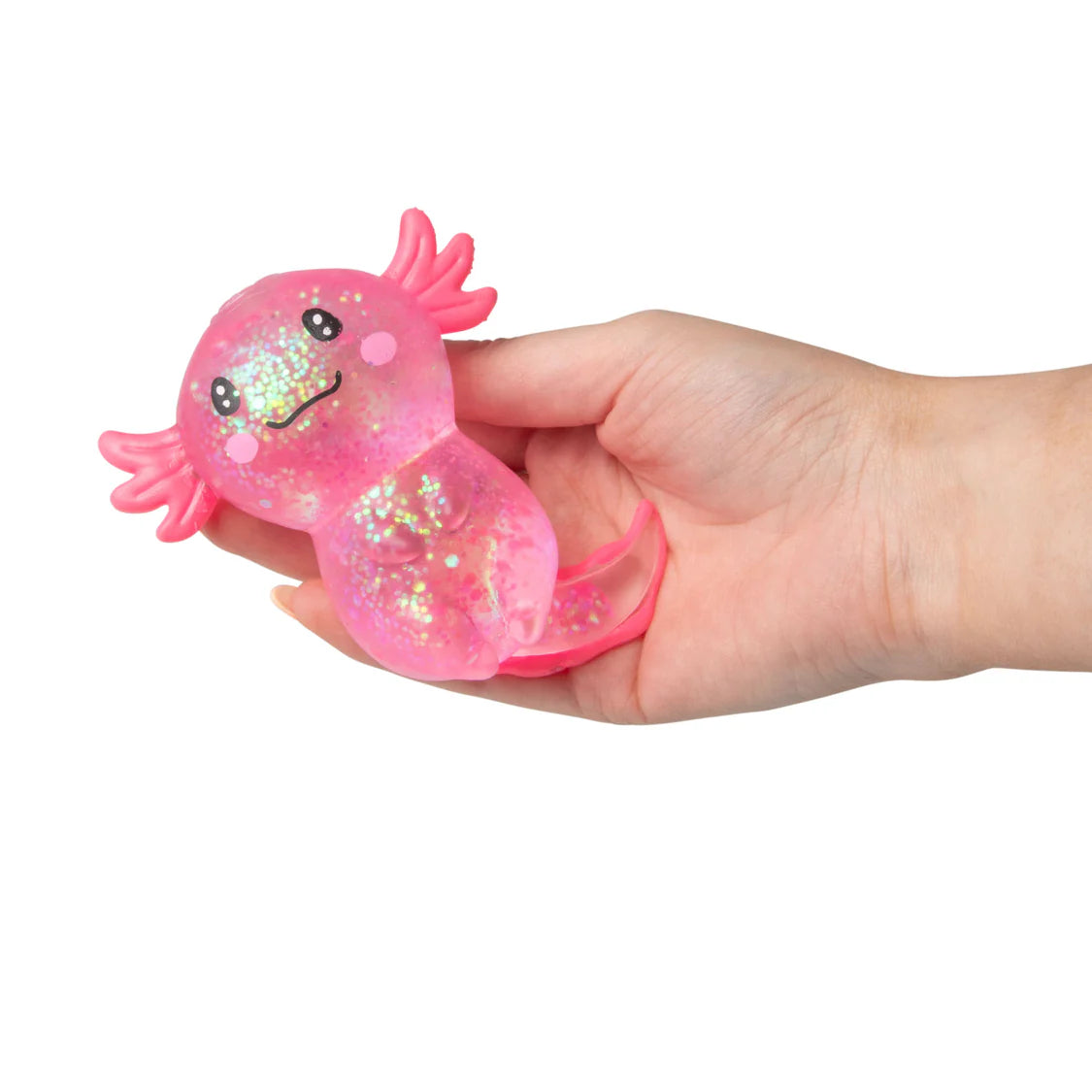 Hand holding a pink axolotl toy with glittery texture on a white background