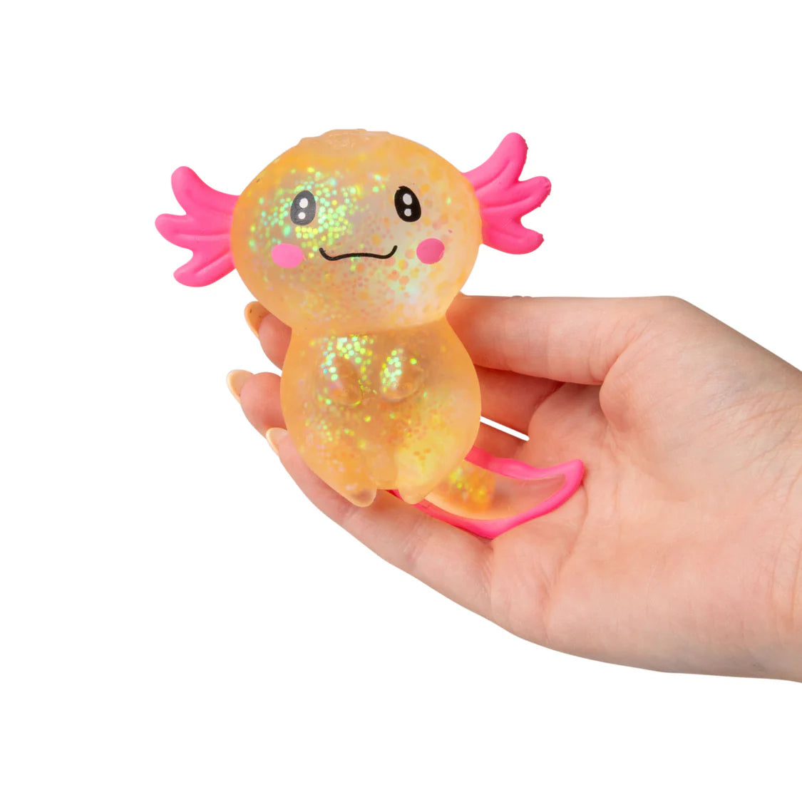 Hand holding a glittery axolotl toy with pink gills on a white background