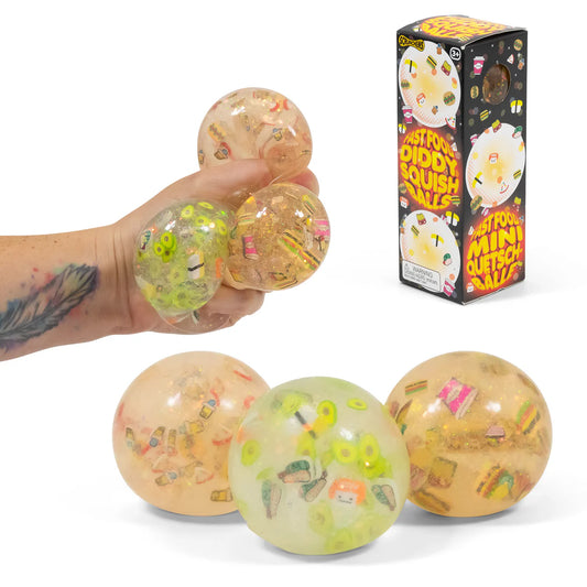Squishy balls with colorful designs held by a hand, next to their packaging.