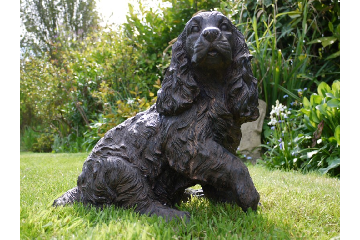 Cocker Spaniel Garden Home Statue in a garden