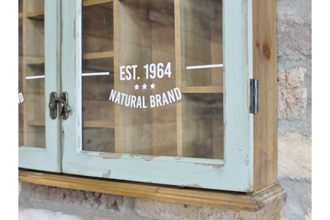 Wooden cabinet with glass doors featuring 'EST. 1964 Natural Brand' text.