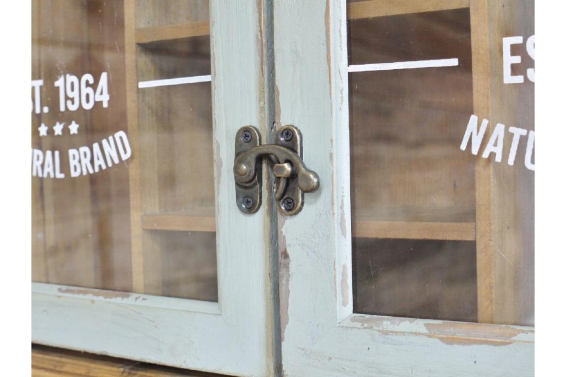 Close-up of a vintage cabinet with glass doors and metal latch.