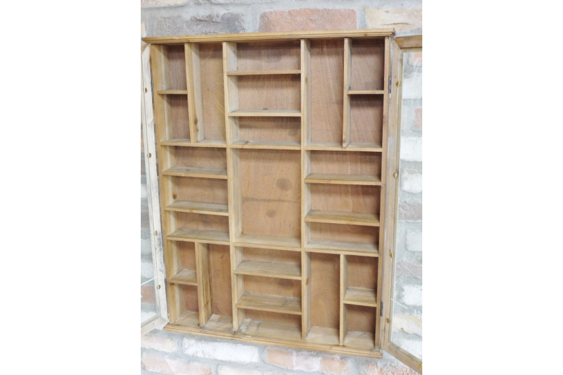 Wooden bookshelf with multiple shelves against a white wall.