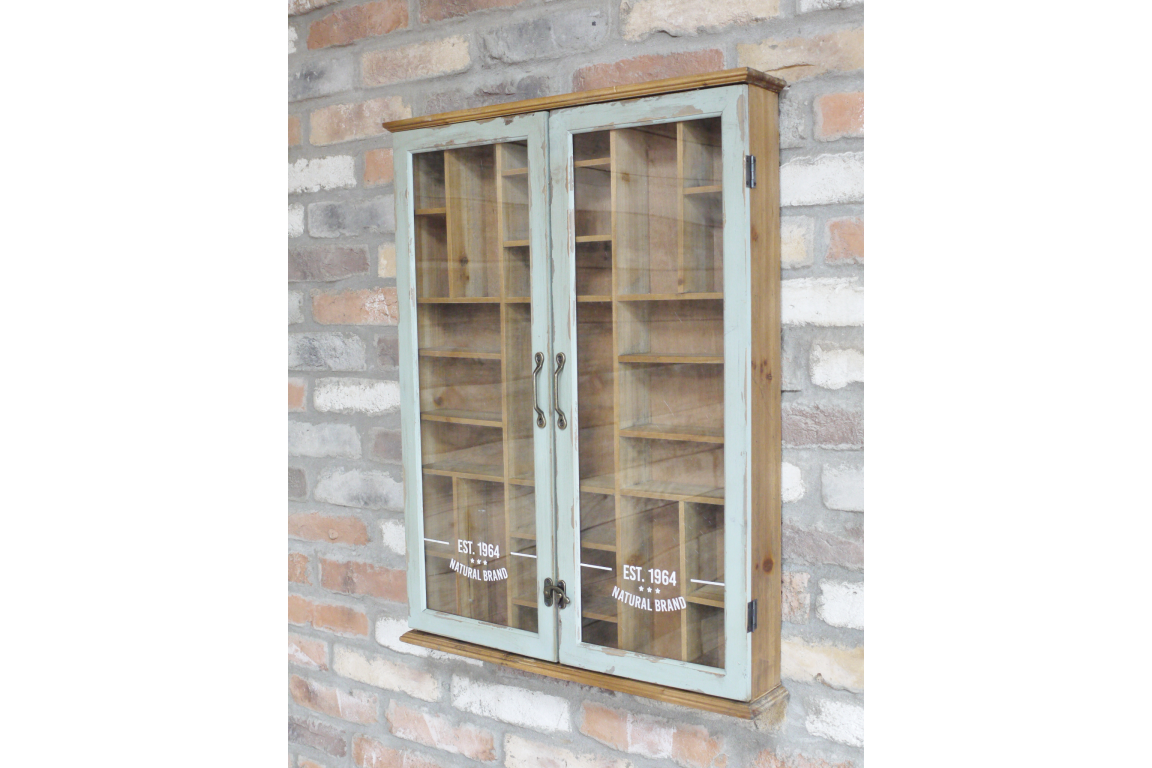 Wooden cabinet with glass doors on a brick wall