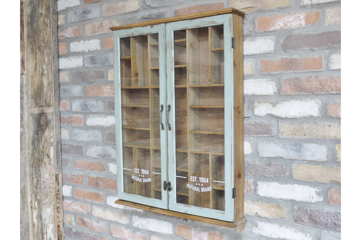 Wooden cabinet with glass doors mounted on a brick wall