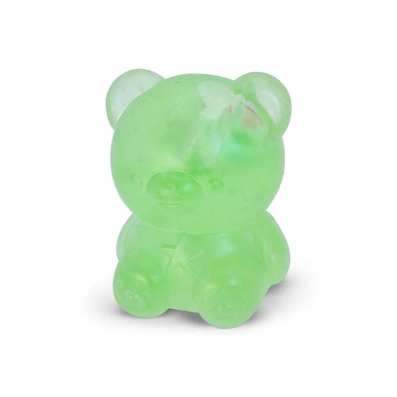 A small translucent light green Scrunchems Kind Heart Squish Bear with a star detail on its chest, photographed against a plain white background.