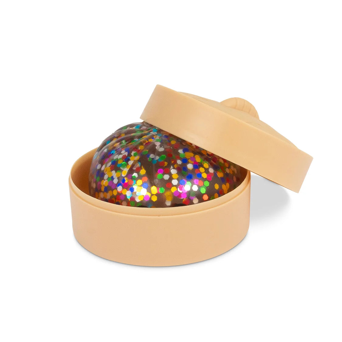 Colourful glittery sugar dumpling in a beige box on a white background