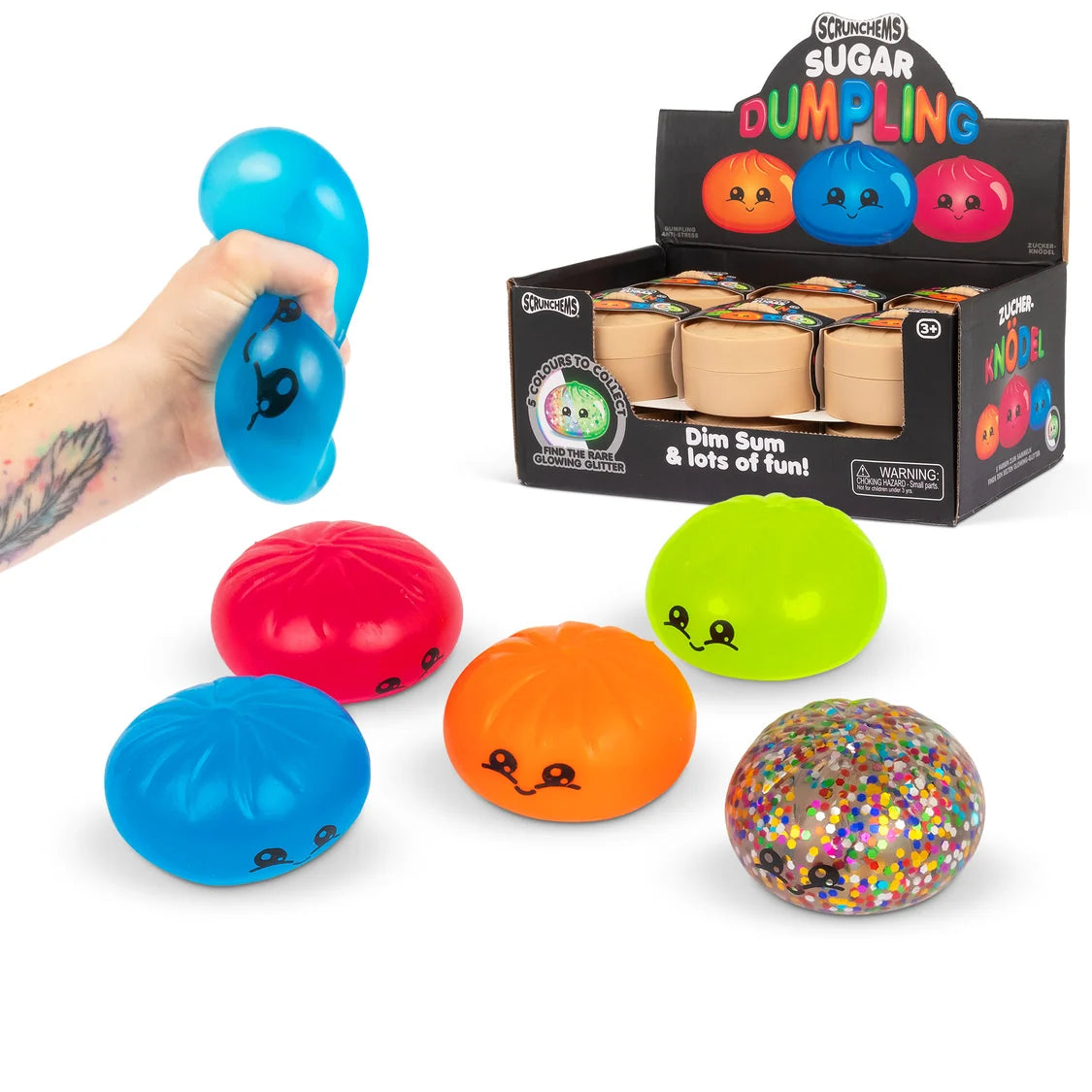 Colorful dim sum-themed stress balls with a hand holding one, displayed in front of their packaging.