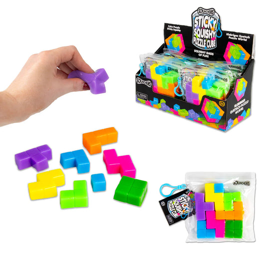 Colorful puzzle cubes with packaging and hand interacting with a cube