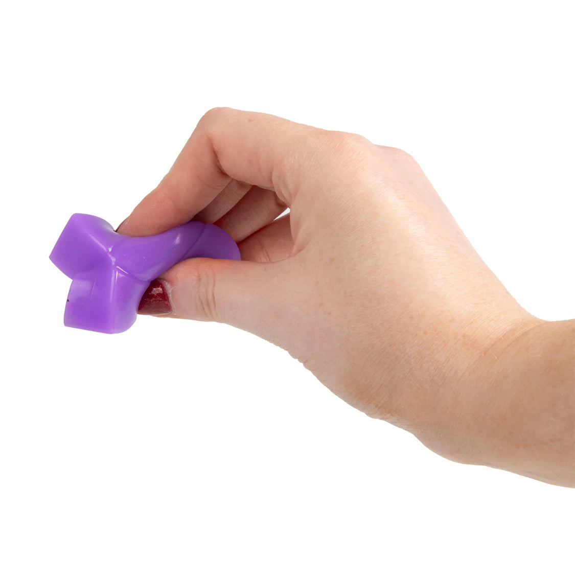 Hand holding a purple squishy puzzle cube against a white background