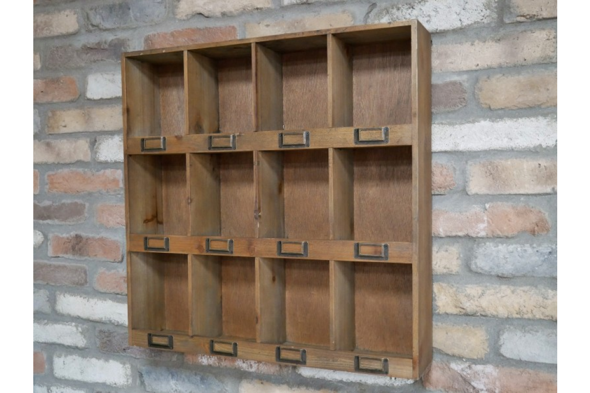 Wooden shelf with multiple compartments against a brick wall.